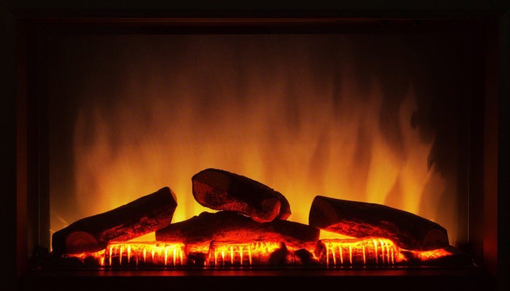 Closeup of electric artificial fireplace with orange fire flame interior