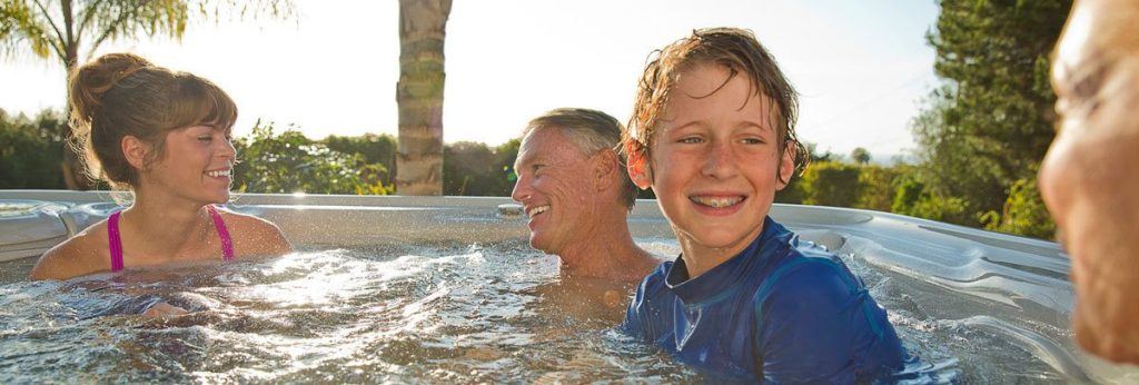 Family enjoying their Vanguard IceGray Hot Spring Spa