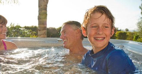 Family enjoying their Vanguard IceGray Hot Spring Spa