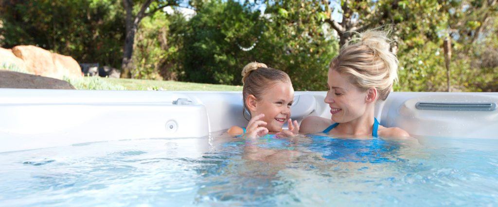 Woman and child enjoying their Hot Spring Hot Tub