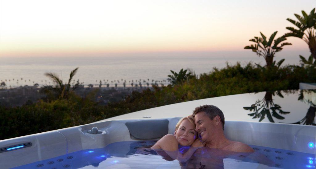 Middle aged couple relaxing in hot tub