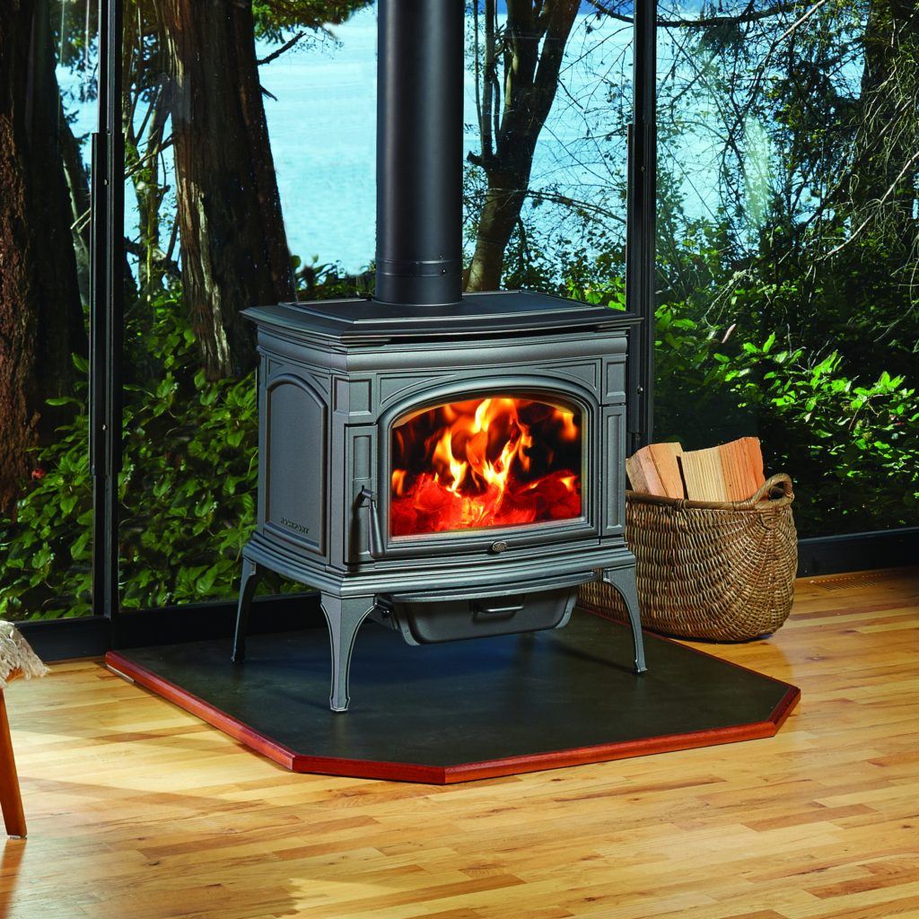 Rockport Hybrid-Fyre™ Wood Stove in living area next to window to garden