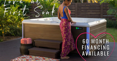 woman standing next to hot tub with text: love at first soak
