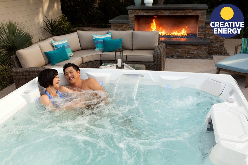 A couple enjoying their new 2018 Limelight hot tub.