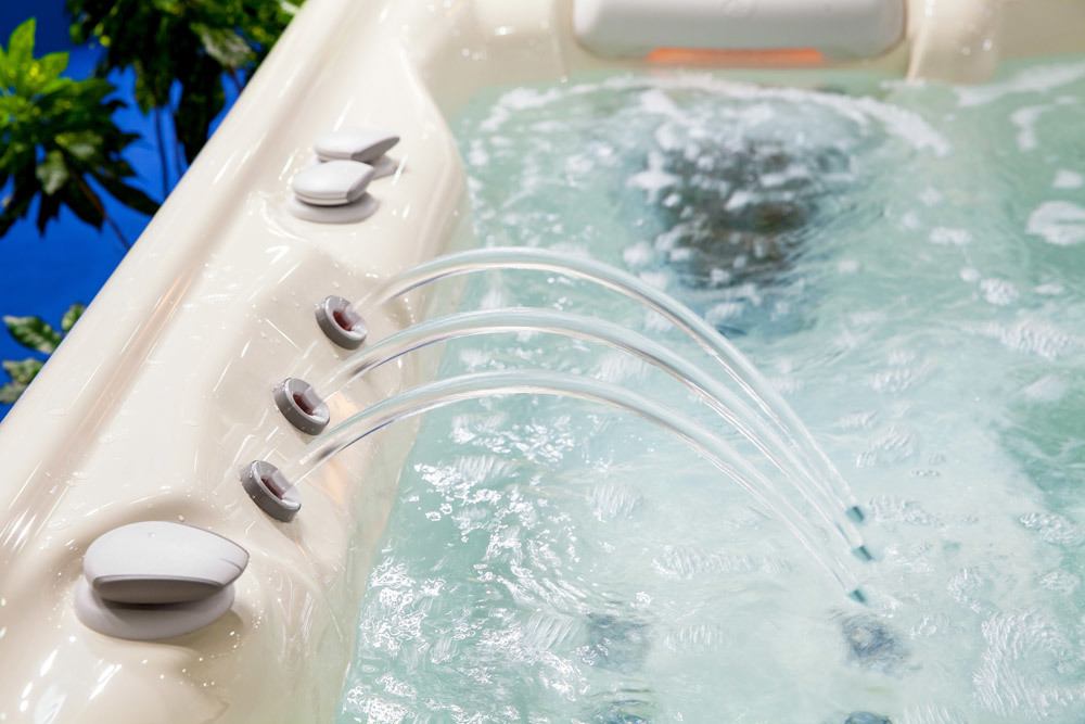 Edge of hot tub with waterfall feature.