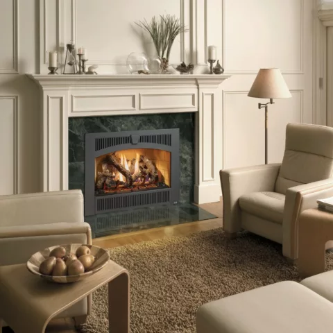 564 TRV 25K Deluxe Fireplace with the Wilmington Face, Stacked Tan Brick Fireback and Classic Oak log set.