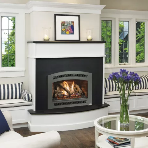 564 TRV 25K Deluxe Fireplace with Classic Arch Black Painted face, Handmade Brick fireback, and Classic Oak log set.