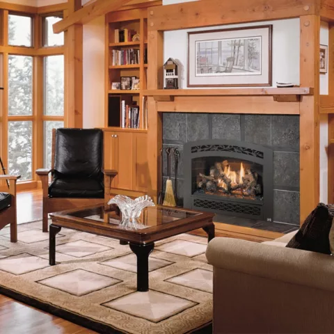564 TRV 25K Deluxe Fireplace with French Country Black Painted face, Handmade Brick fireback, and Classic Oak log set.