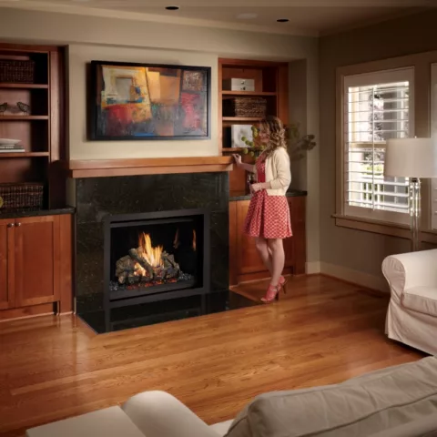 864 TV 40K Clean Face Deluxe Fireplace with Tile Trim Kit, Black Glass fireback, and Classic Oak log set.