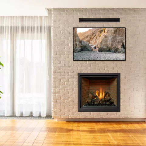 ProBuilder 36 Clean Face Fireplace with Brick Fireback, Ember-GloTM, and CoolSmart TV Wall Kit.