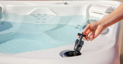 Hot Springs Hot Tub with a FreshWater Salt System cartridge being installed
