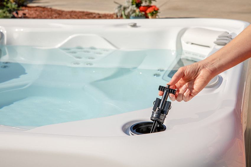 Hot Springs Hot Tub with a FreshWater Salt System cartridge being installed