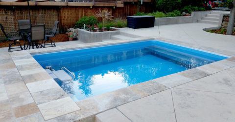 swim spa installed completely in ground in backyard