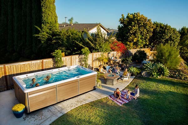 Backyard makeover for summer with endless pool, hot tubs and fire pits