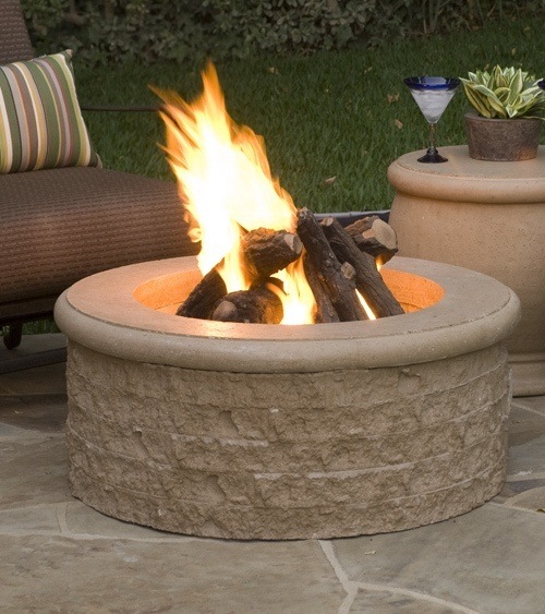 beautiful fire pit in a backyard on a summer evening 