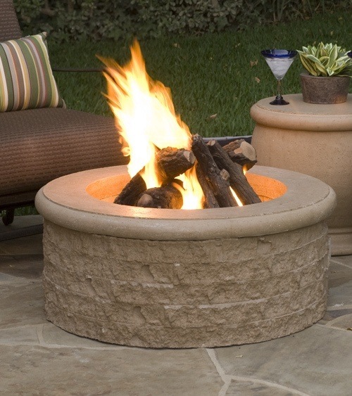 beautiful fire pit in a backyard on a summer evening