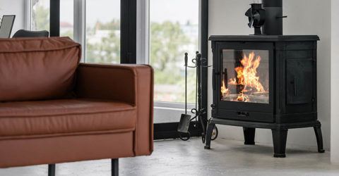 a freestanding wood burning stove in a beautiful modern living rom