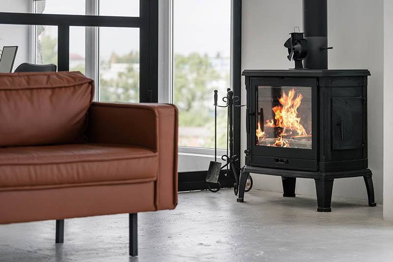 a freestanding wood burning stove in a beautiful modern living rom