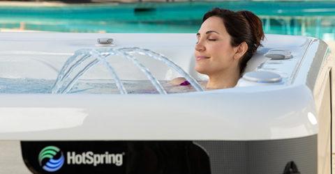 Women relaxing in a Hot Springs hot tub with waterfall feature