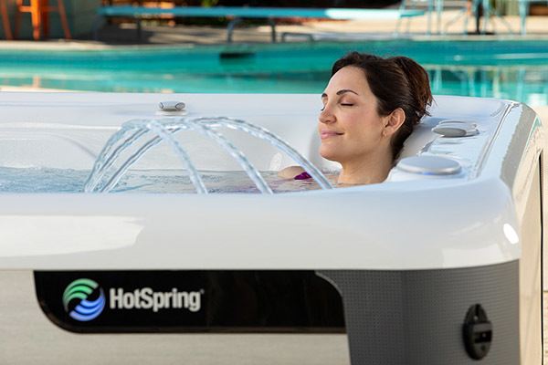 Women relaxing in a Hot Springs hot tub with waterfall feature