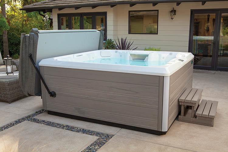 brand new hot tub installed in backyard