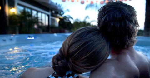 Couple enjoying a Romantic Valentine’s Day Experience at Home with their HotSprings Spa