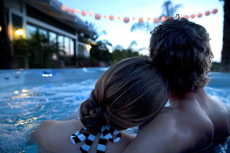 Couple enjoying a Romantic Valentine’s Day Experience at Home with their HotSprings Spa