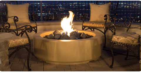 create entertaining space in your backyard with an outdoor fire feature like a fire table