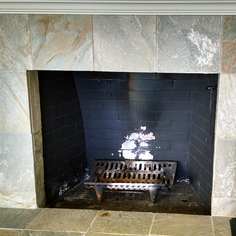 Photo provided by Creative Energy customer: a traditional fireplace mantel before a gas fireplace insert has been installed 