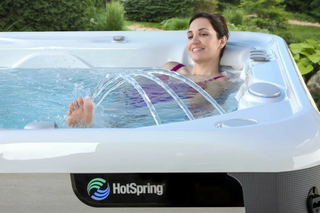 Woman relaxing in HotSpring spa with fountain