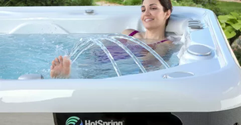 Woman relaxing in HotSpring spa with fountain