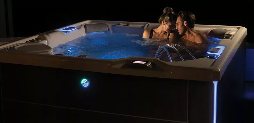 Couple relaxing in their hot tub