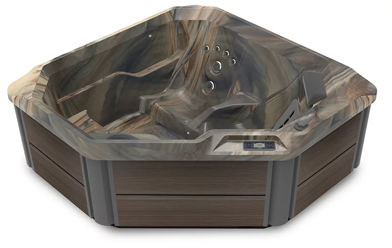 A Hot Spot hot tub in a rounded triangle shape with a shell that has a multigrain look that simulates wood. 