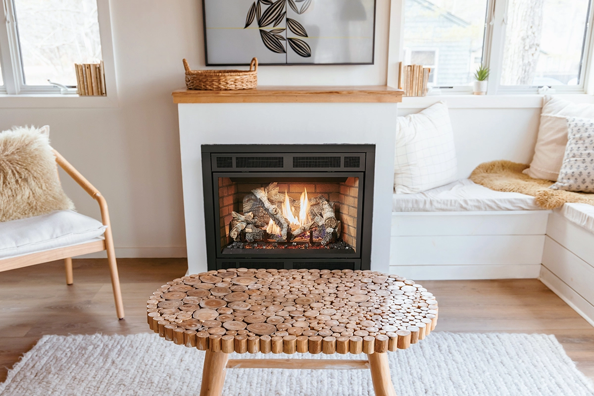 A cozy living room with neutral decor and wooden furniture and a fireplace